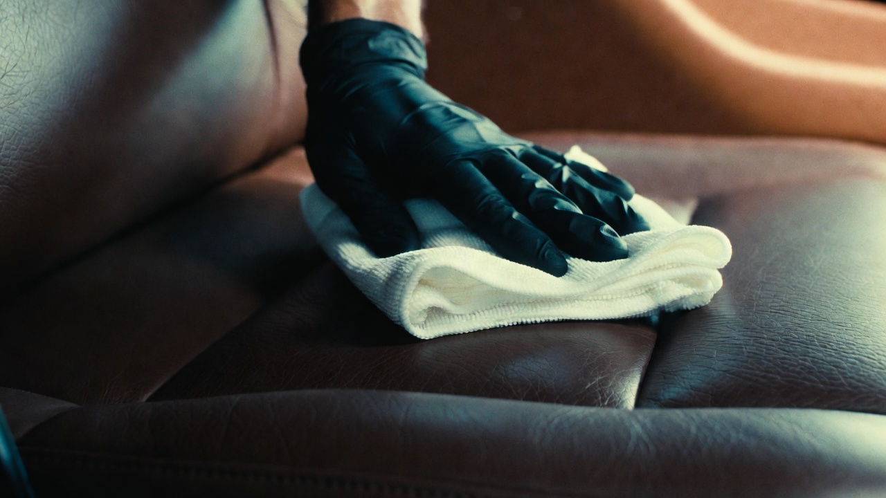 Hand-finished leather conditioning and protection during mobile interior car detailing